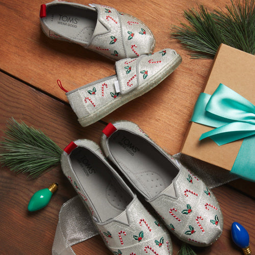 Lifestyle shot of holiday alpargatas featring candy canes