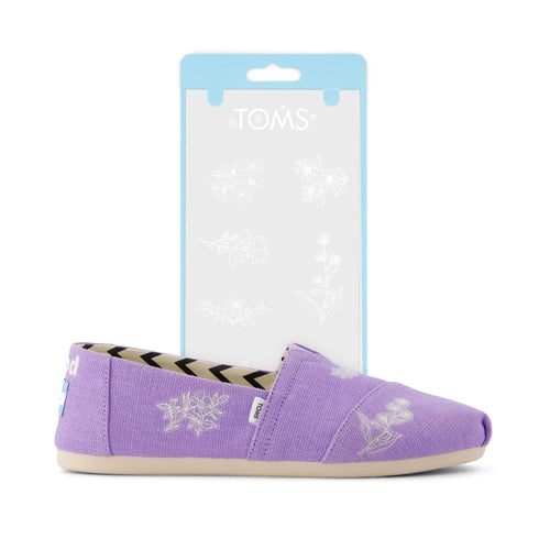 toms shoe tattoo white floral shown on purple shoe detail shot