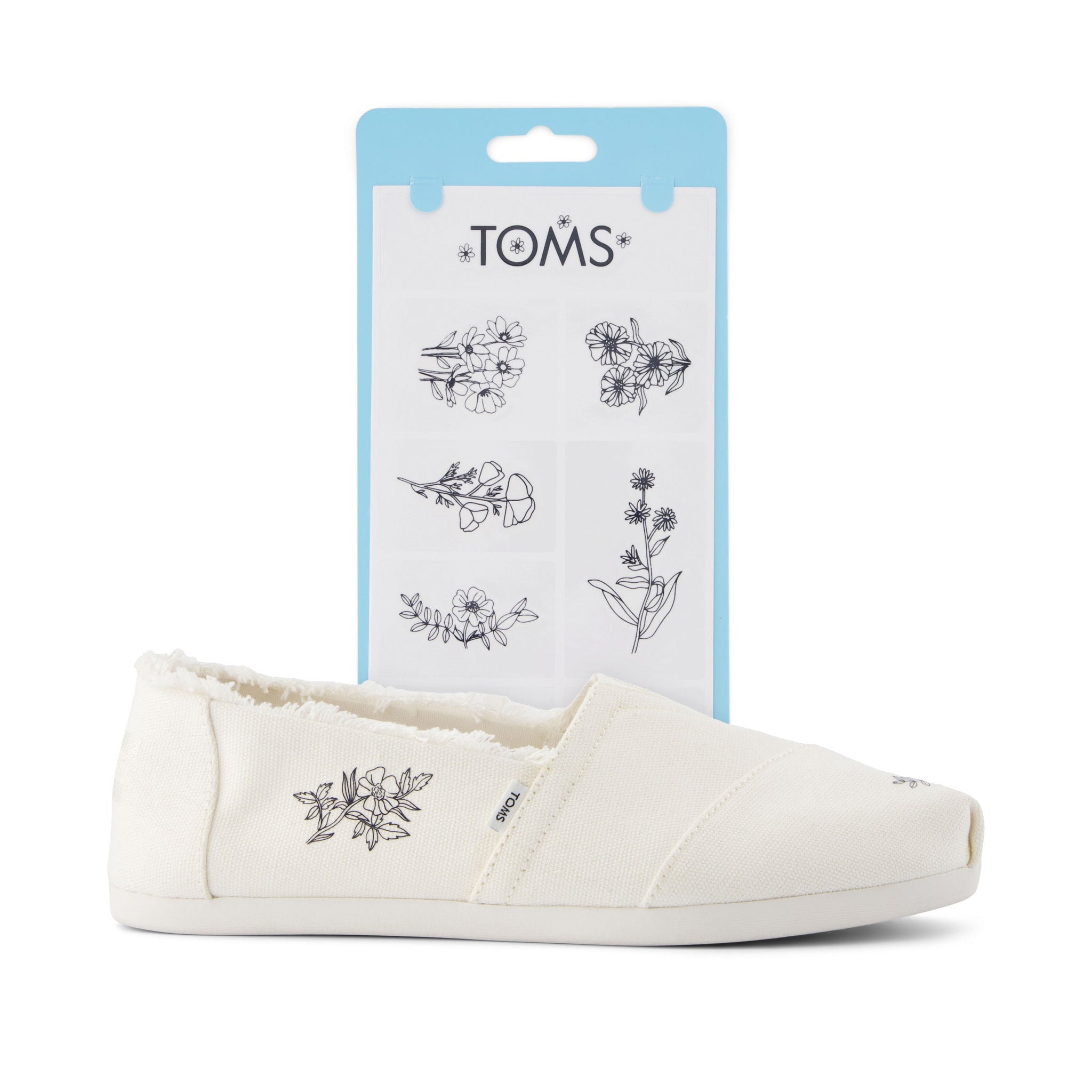 toms shoe tattoos in floral print shown on shoe detail shot