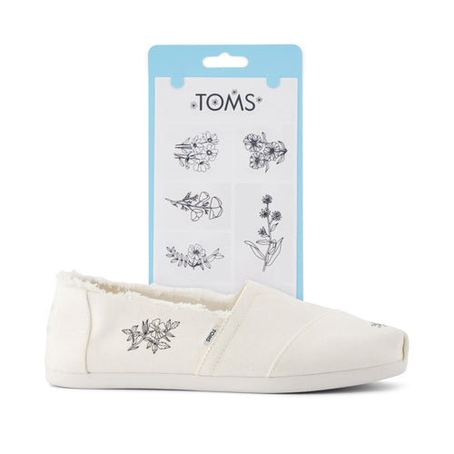 toms shoe tattoos in floral print shown on shoe detail shot