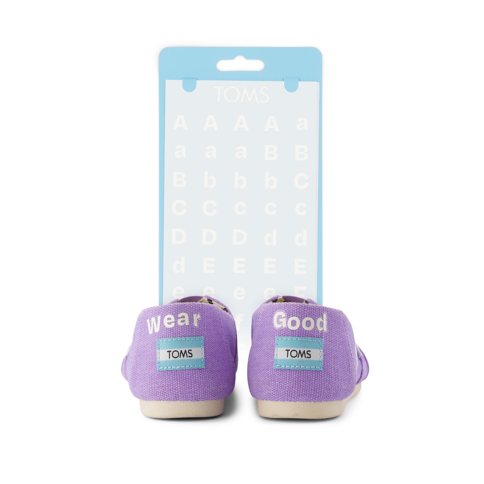 toms shoe tattoo white letters shown on purple shoe