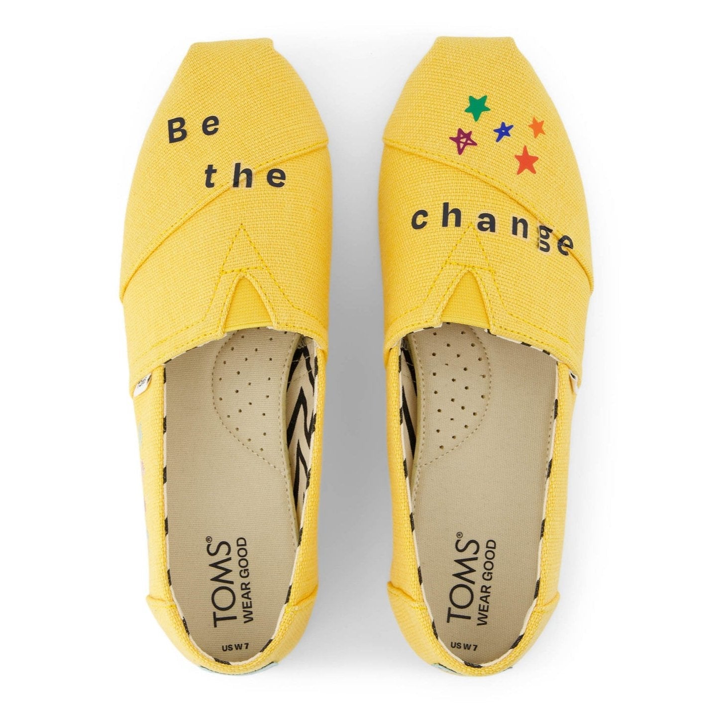 blue shoe tattoo letters shown on a yellow alpargata detail vew