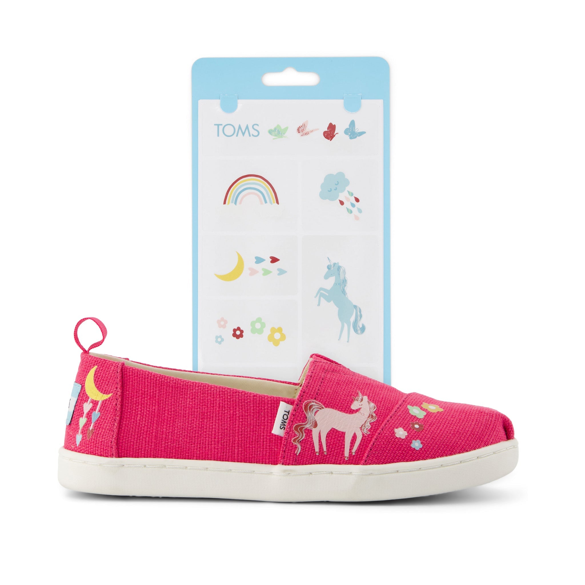 toms shoe tattoos unicorn and rainbow designs shown on pink shoe detail shot