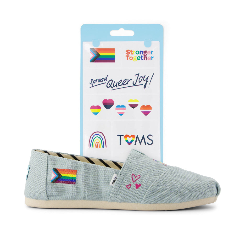 toms shoe tattoo with pride rainbow flags shown on shoe detail shot