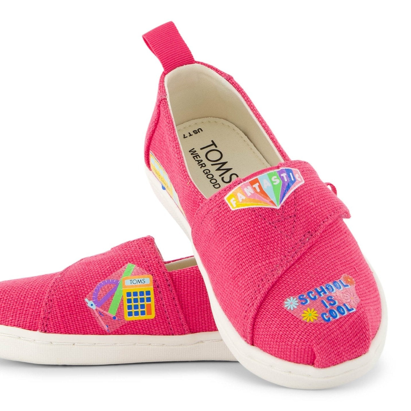 TOMS shoe tattoos school is cool pack on bright pink shoe close up detail shot