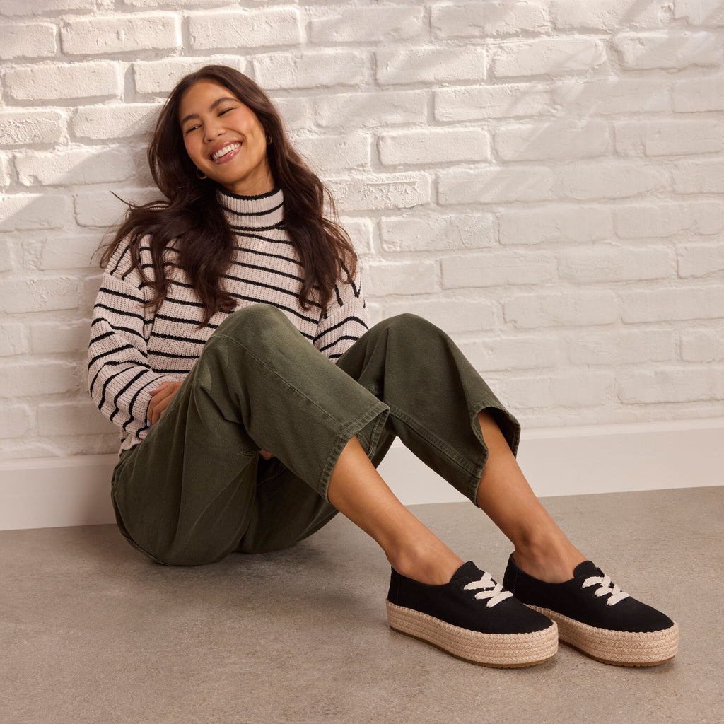 On model image of the black Valencia lace up espadrille