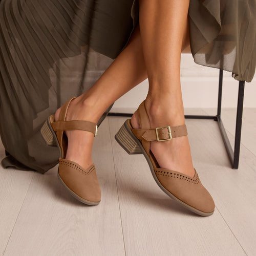 On model image of the brown perforated leather Jaclyn heel