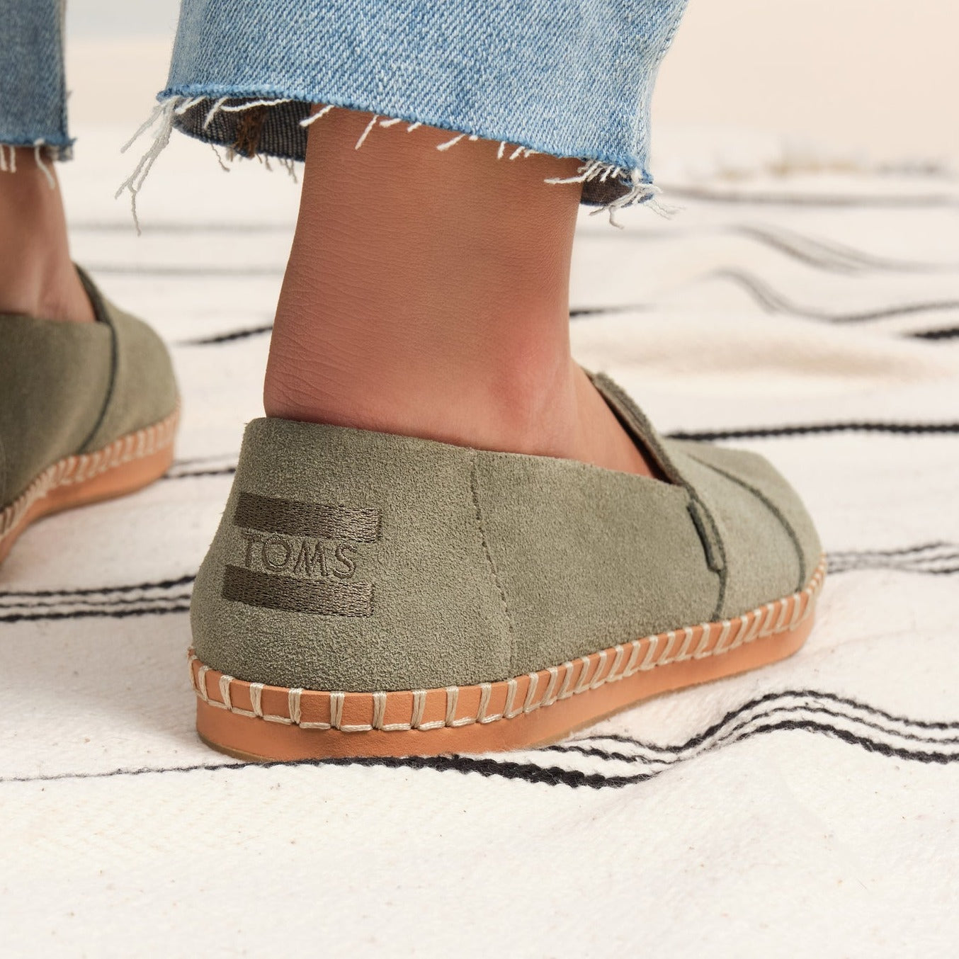 Close Up Back View Of Green Suede Leather Wrapped Espadrille