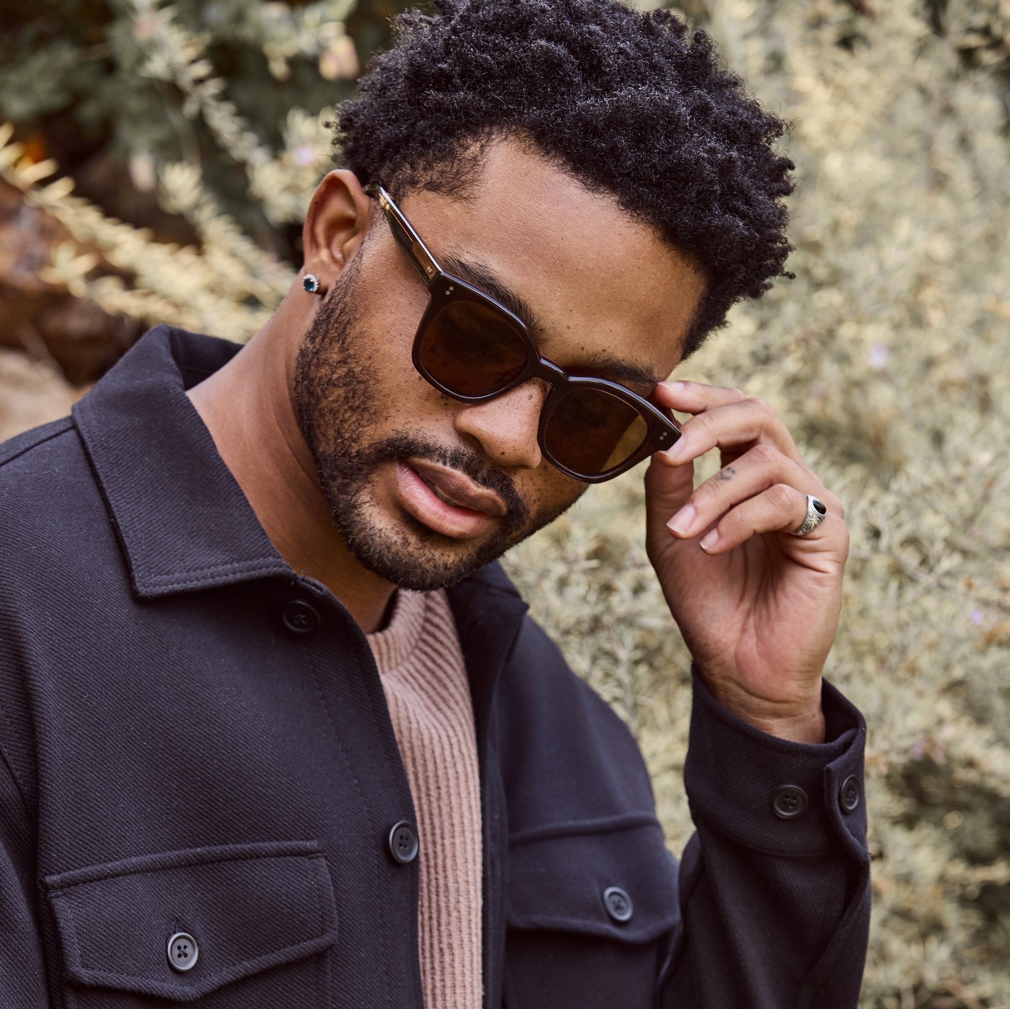 rome sunglasses in cacao crystal on male model up close detail shot