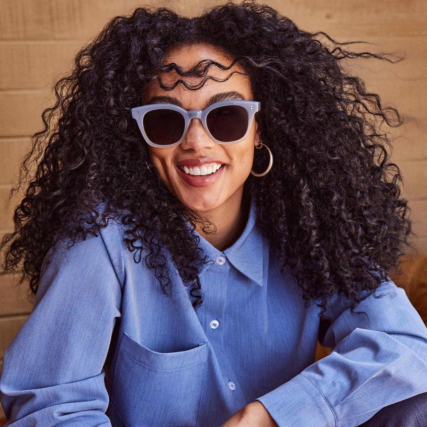 rome sunglasses in chalky blue on female model up close detail shot