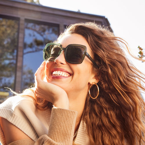 athena traveler sunglasses in spruce green up close on model detail shot