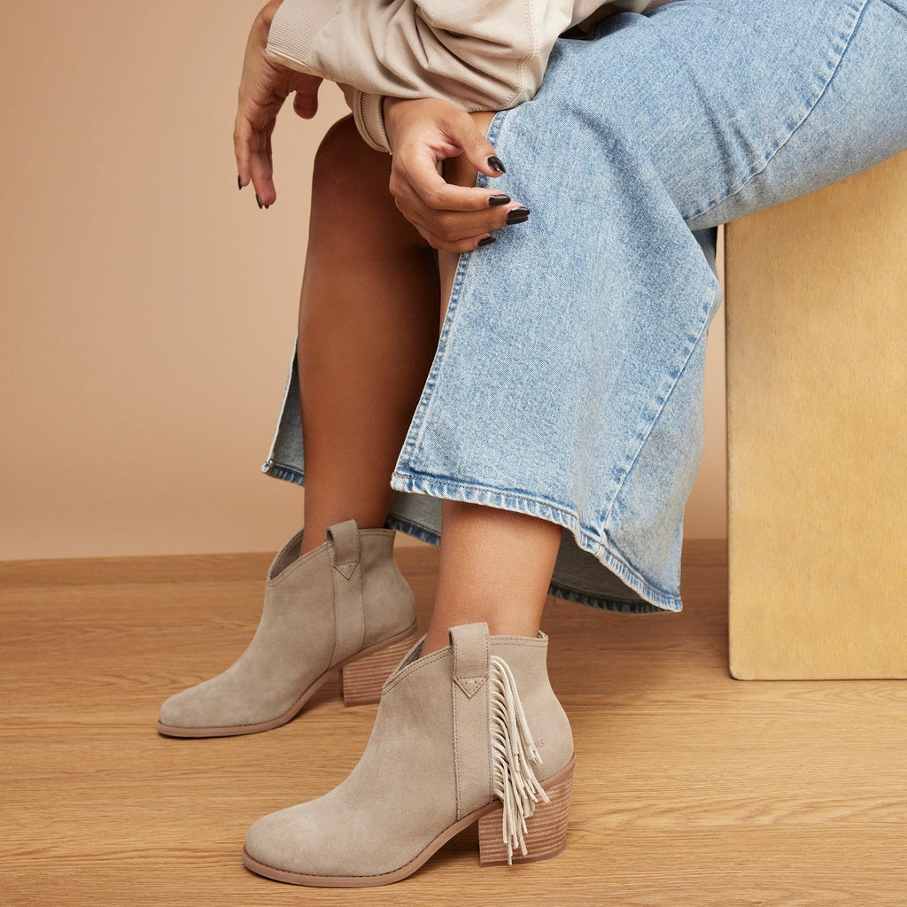 constance western inspired boot with fringe in dune suede up close detail shot