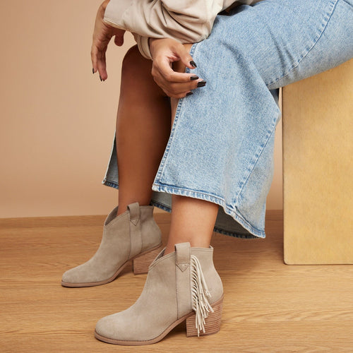 constance western inspired boot with fringe in dune suede up close detail shot