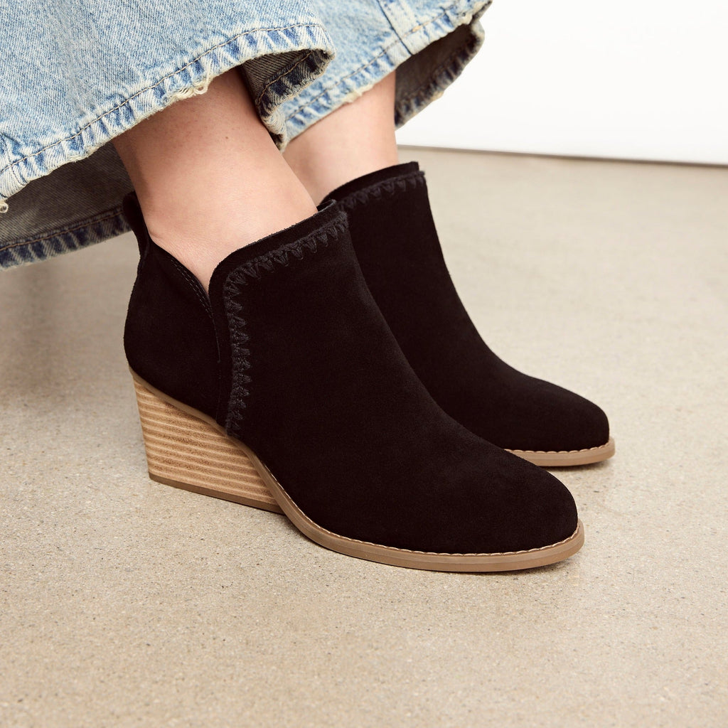 kaia wedge boot with tonal deco stitching up close on model detail shot