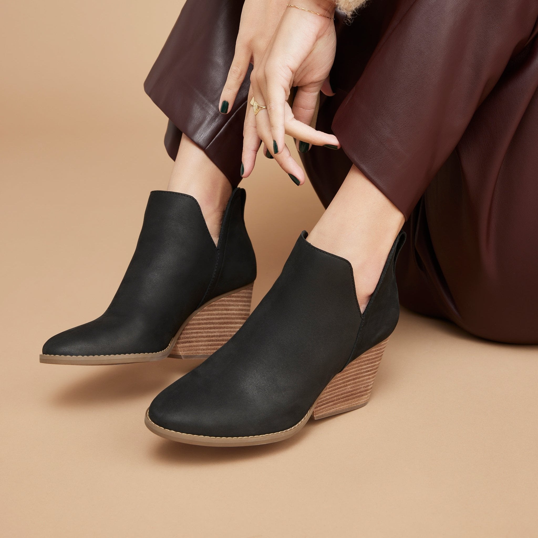 eliza wedge boot in black leather n model up close detail shot