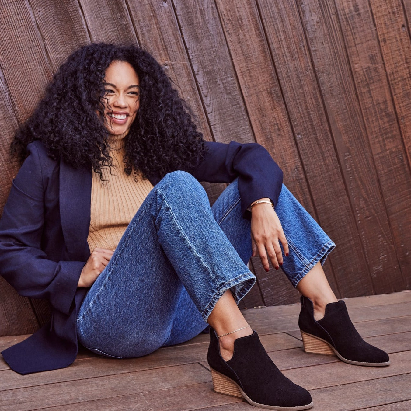 gwen wedge boot with undercut heel in black suede on model