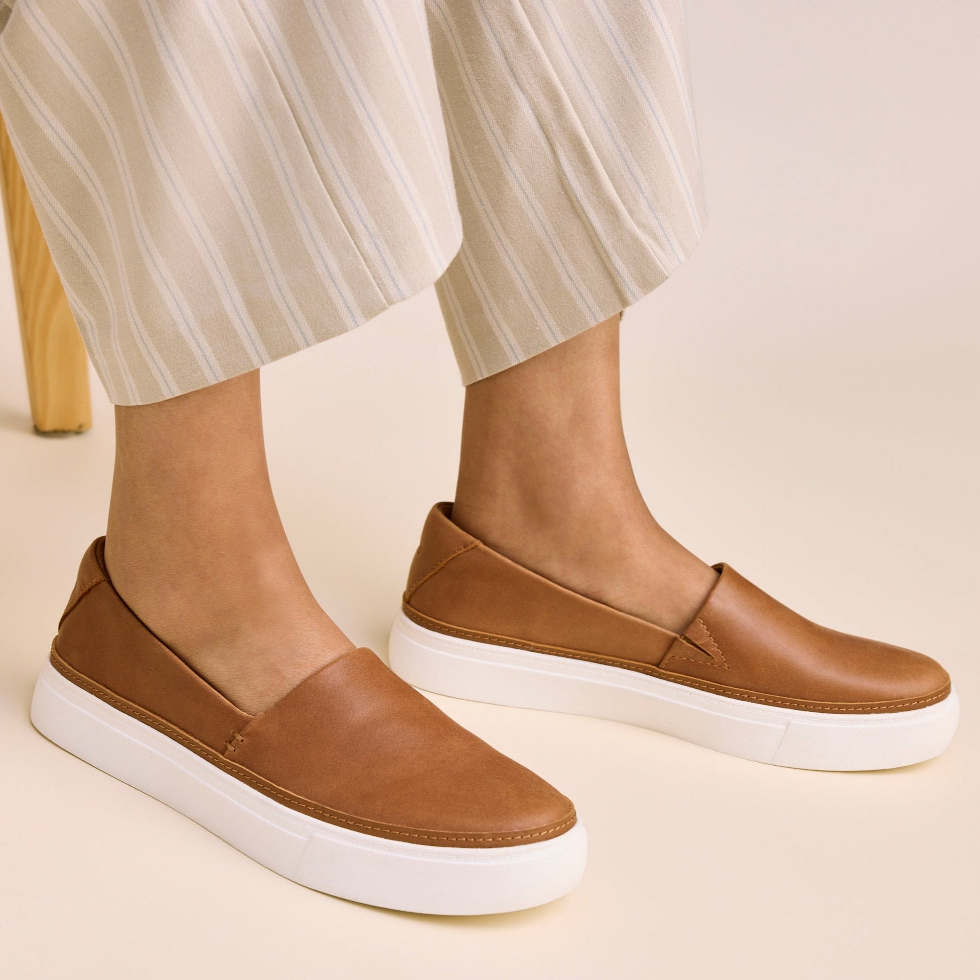 On figure close up image of the brown sugar leather Kameron Slip On sneaker