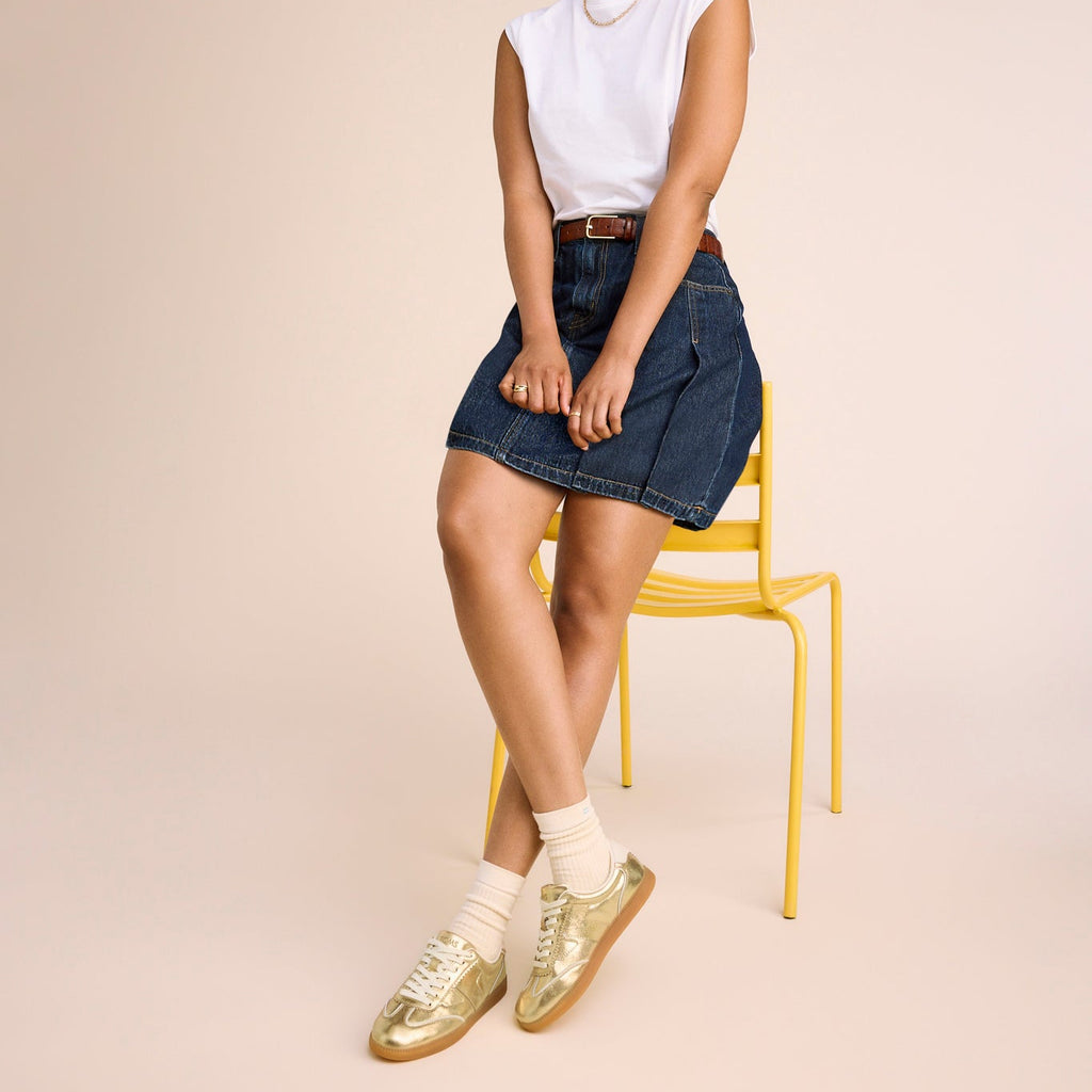 On figure image of the Collins Gold Metallic Leather Sneaker