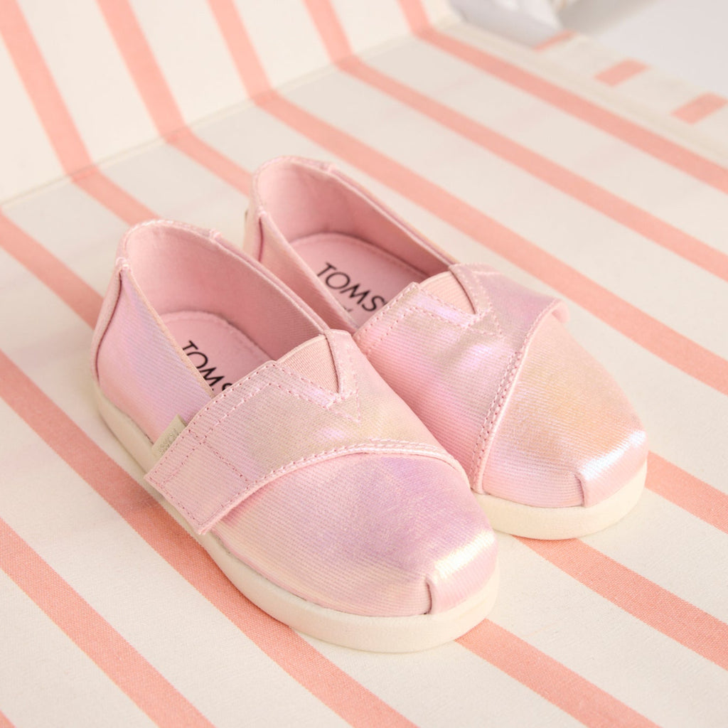 Laydown image of the Alpargata Classic TPR Pink Quartz Iridescent Twill Toddler Shoe