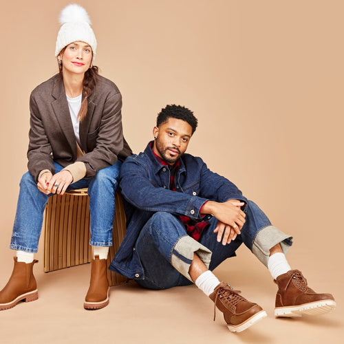men's water resistant leather palomar boot on model sitting next to woman wearing boots
