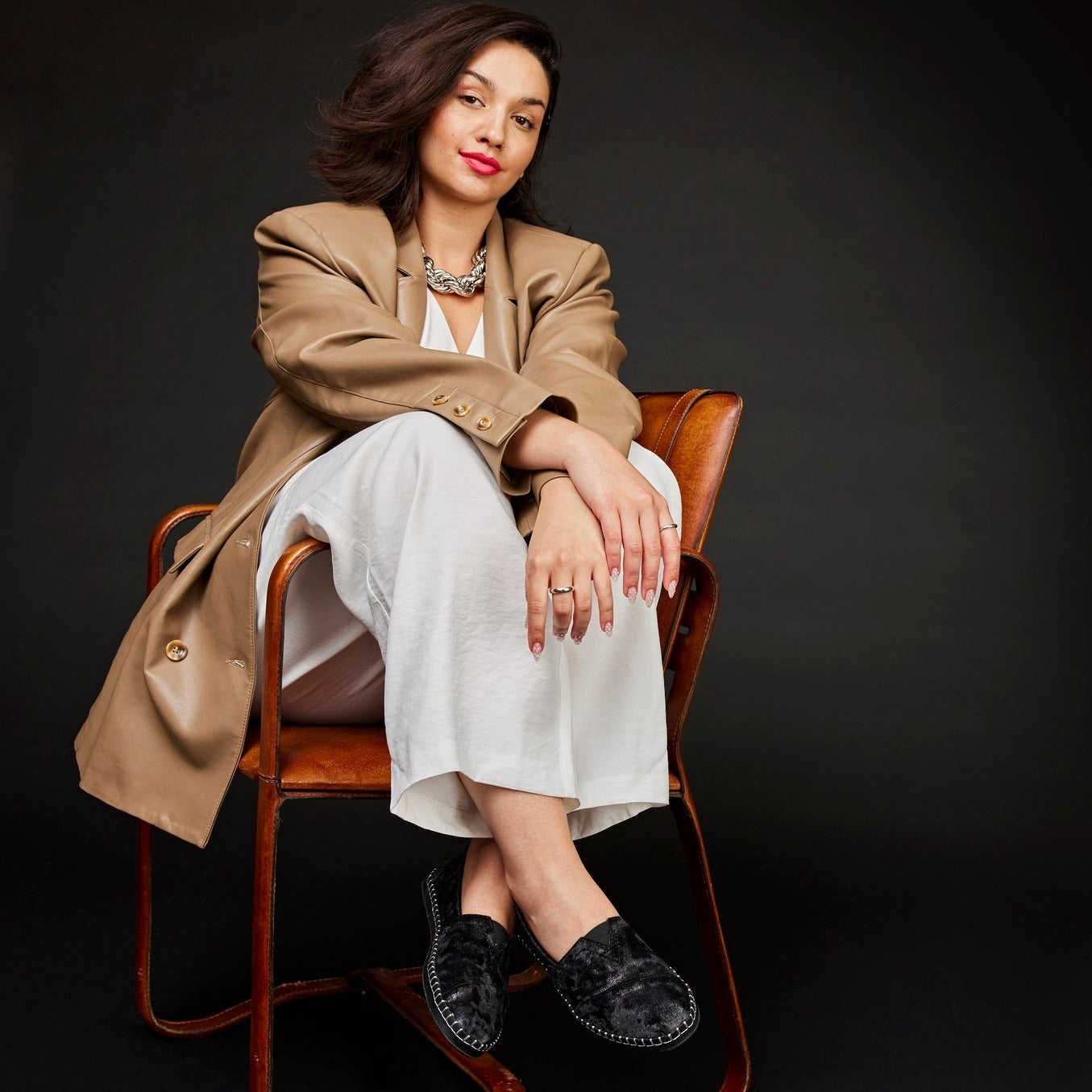 Alpargata Plush Black Leather Wrap On Model Seated In Chair