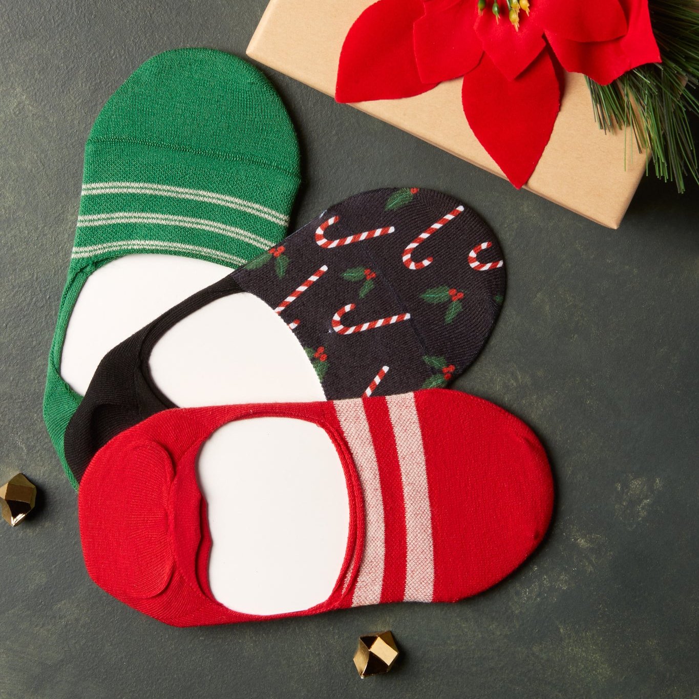 lifestyle imagery of holiday socks featuring candy cane print