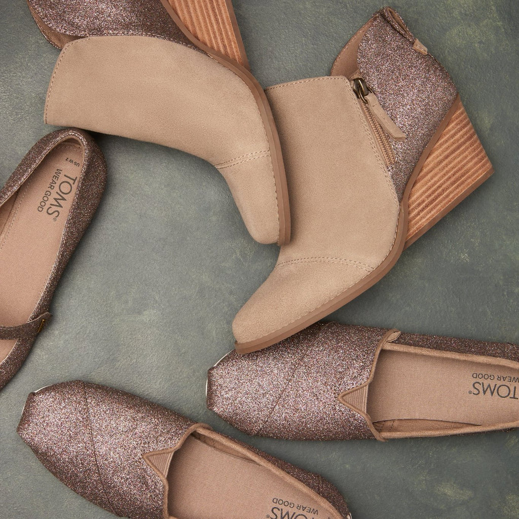 Laydown shot of the rainbow glitter Goldie boot and alpargata