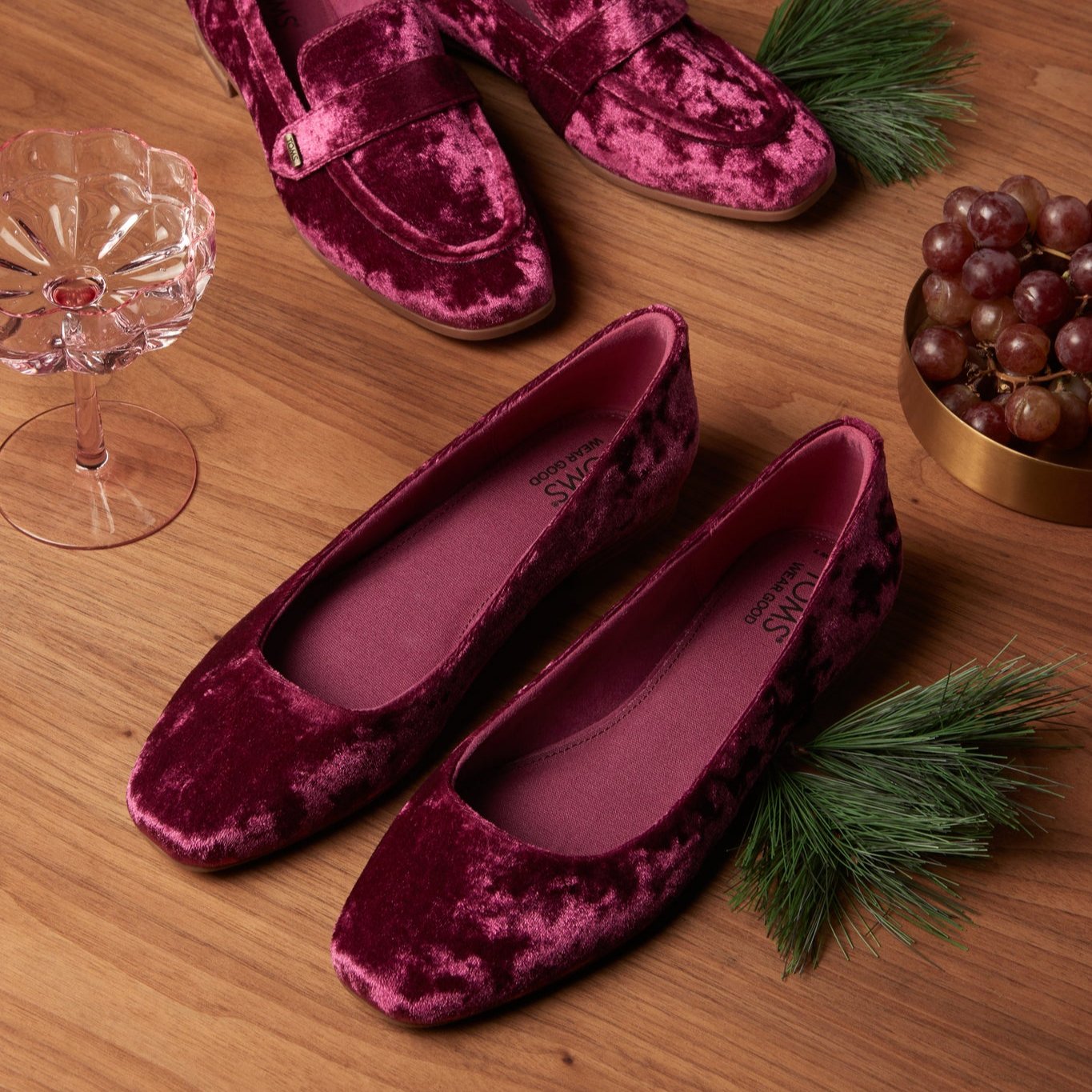 Laydown shot of the burgundy crushed velvet Briella ballet flat