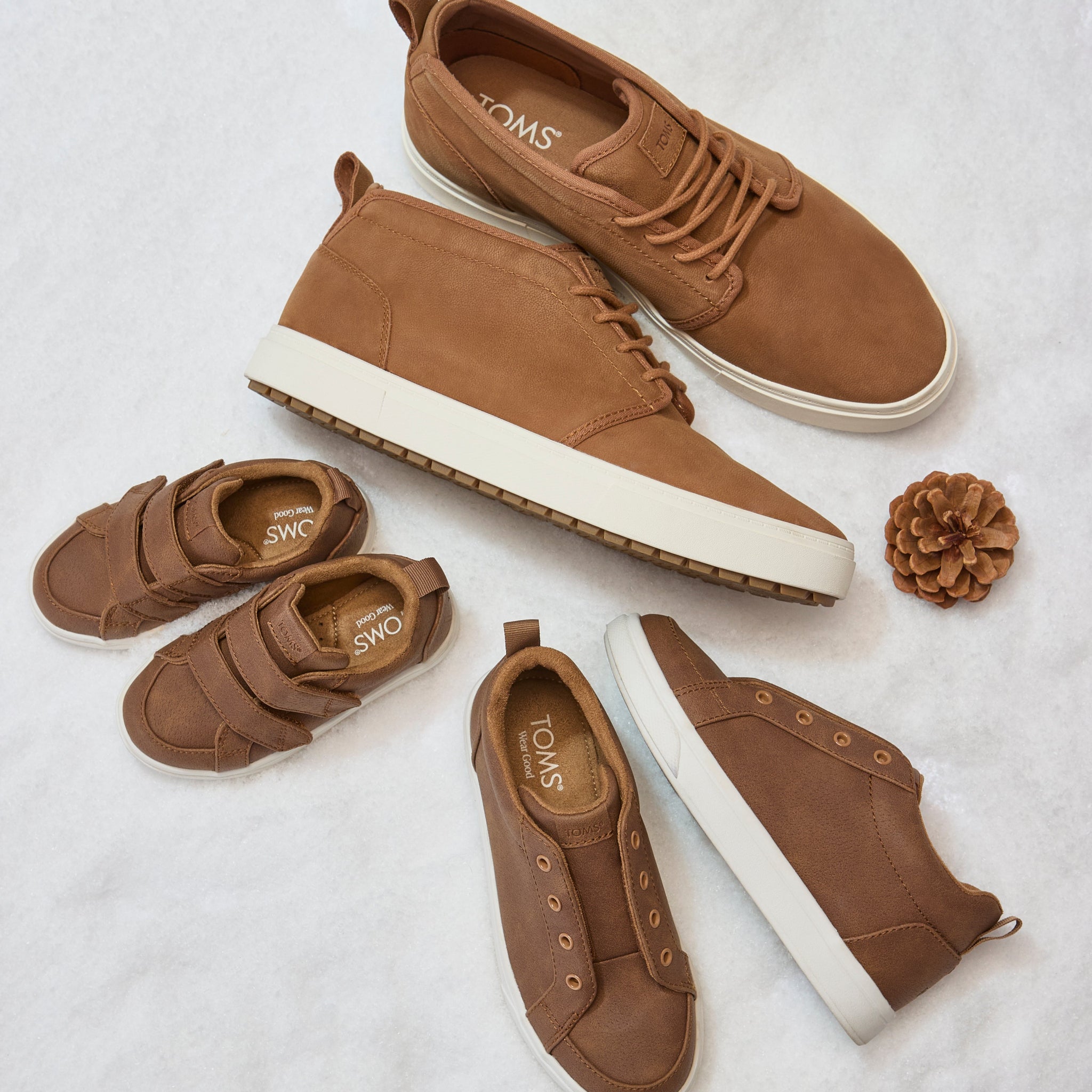 Men's Carlo Mid Terrain 2.0 Sneaker in Water Resistant Tan Leather Laydown Image with Kids Cruz Double Strap Sneaker and Fenix Mid Sneaker in Toffee