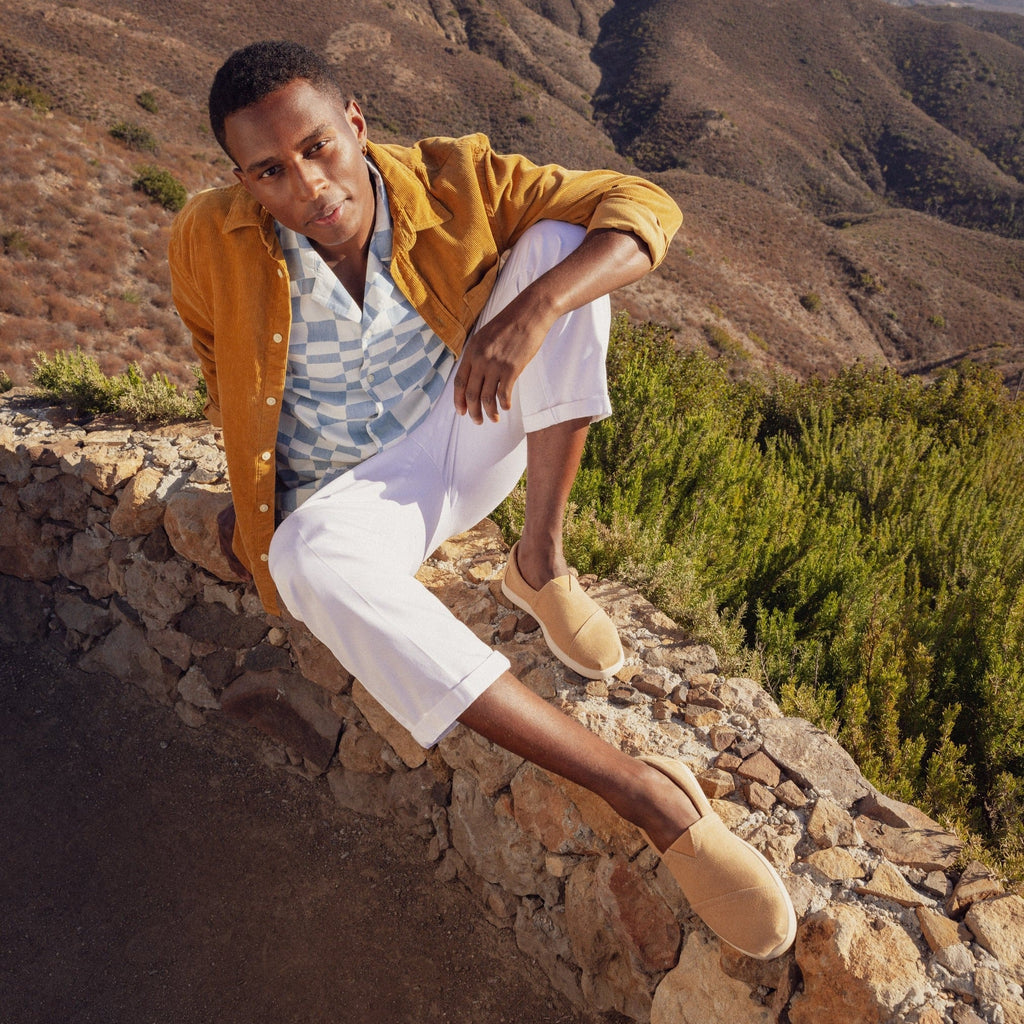 Alpargata Fwd Slip On Shoe Shown On Model In Doe Canvas In A Mountain Scape