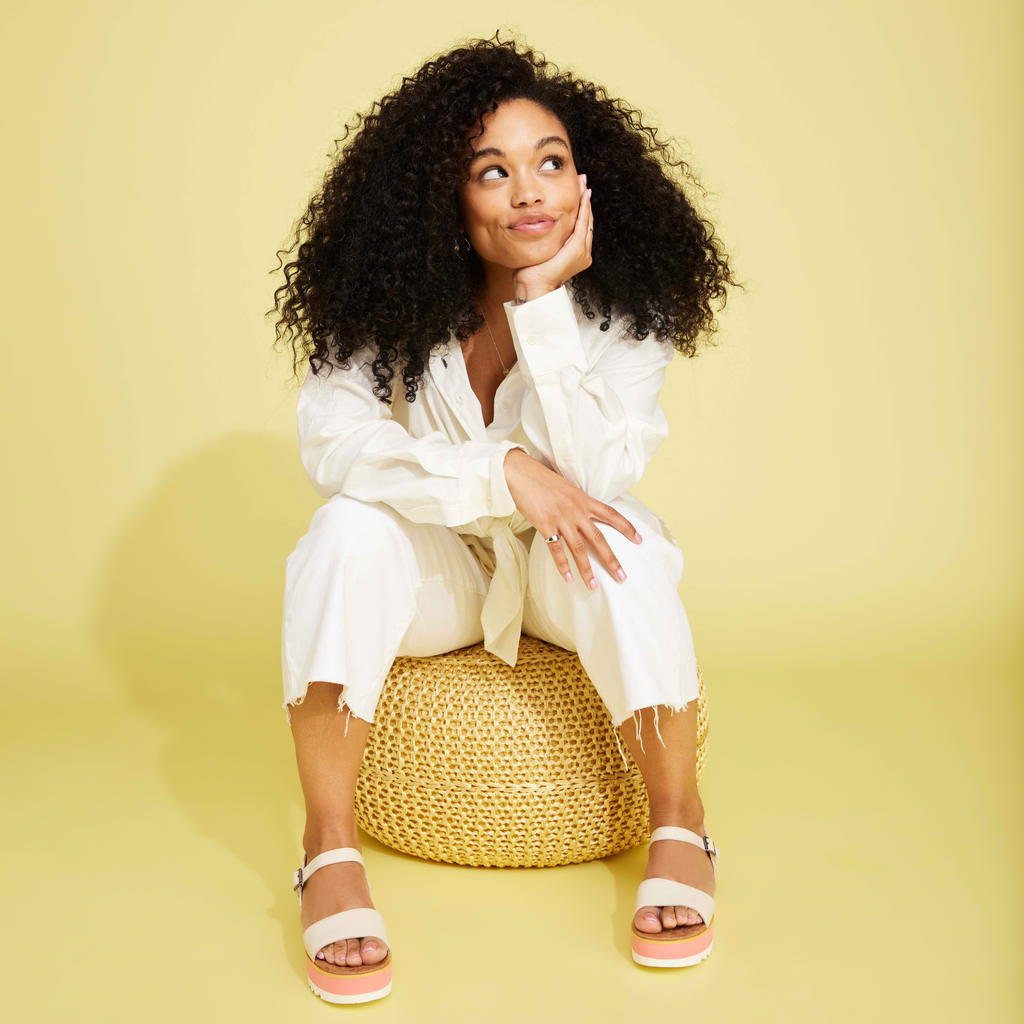 Brynn Leather Sandal In Cream Colorway On Model Wearing White Denim Pants And White Shirt