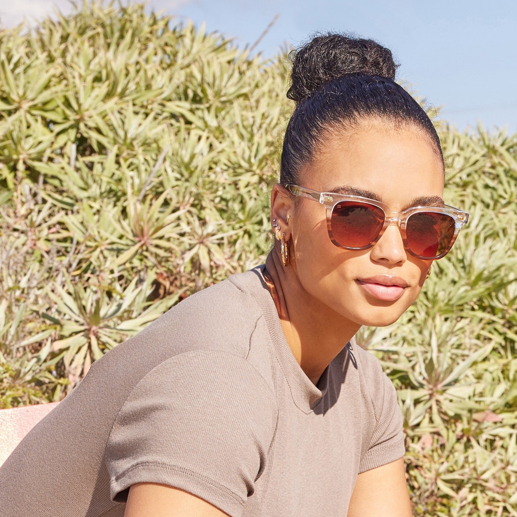 memphis mocha stripe sunglasses on female model up close detail shot
