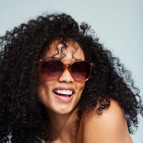 Sandela sunglasses in apricot crystal on model detail shot