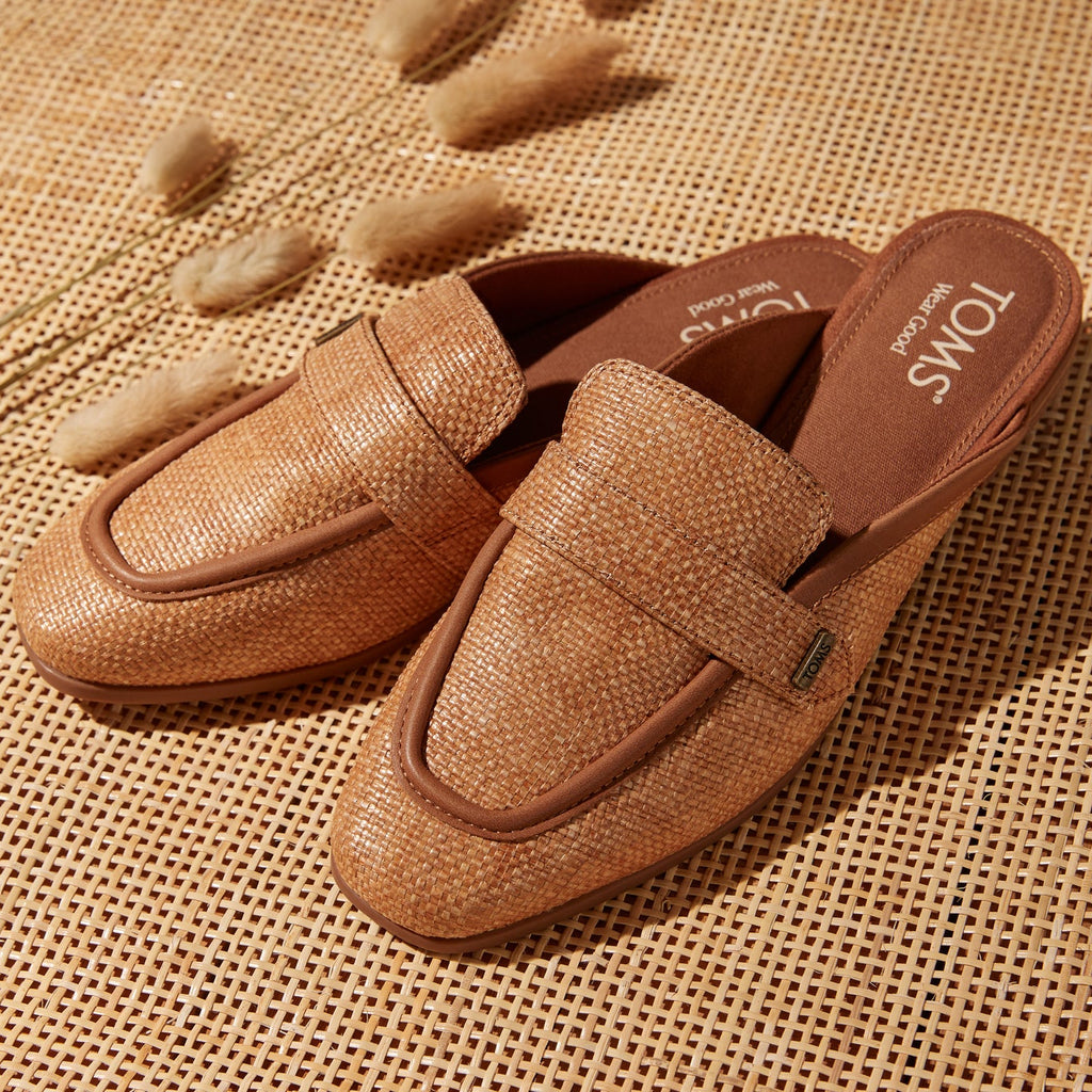 Laydown image of the brown sugar raffia leather Lynette Mule