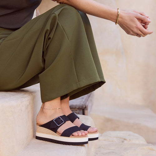 On figure image of the black canvas Diana Mule Buckle Wedge Sandals