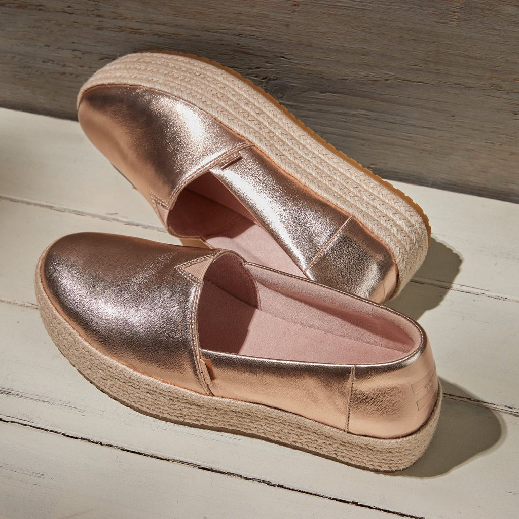 Laydown image of the rose gold metallic napa leather Valencia espadrilles