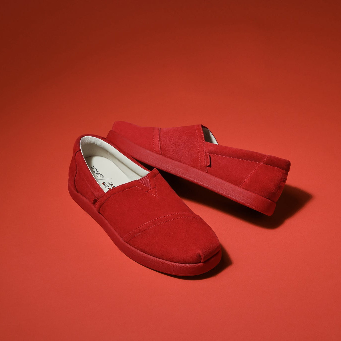 Laydown image of the cherry Suede Jamie Mizrahi Alp FWD