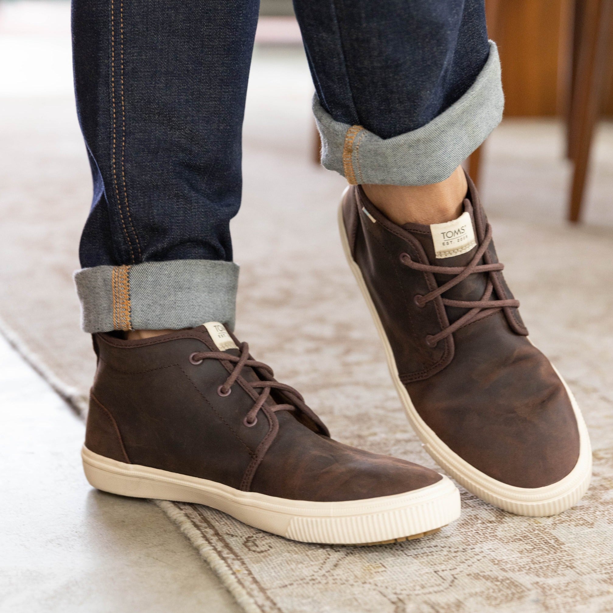 carlo mid terrain in water resistant brown leather on model up close detail shot