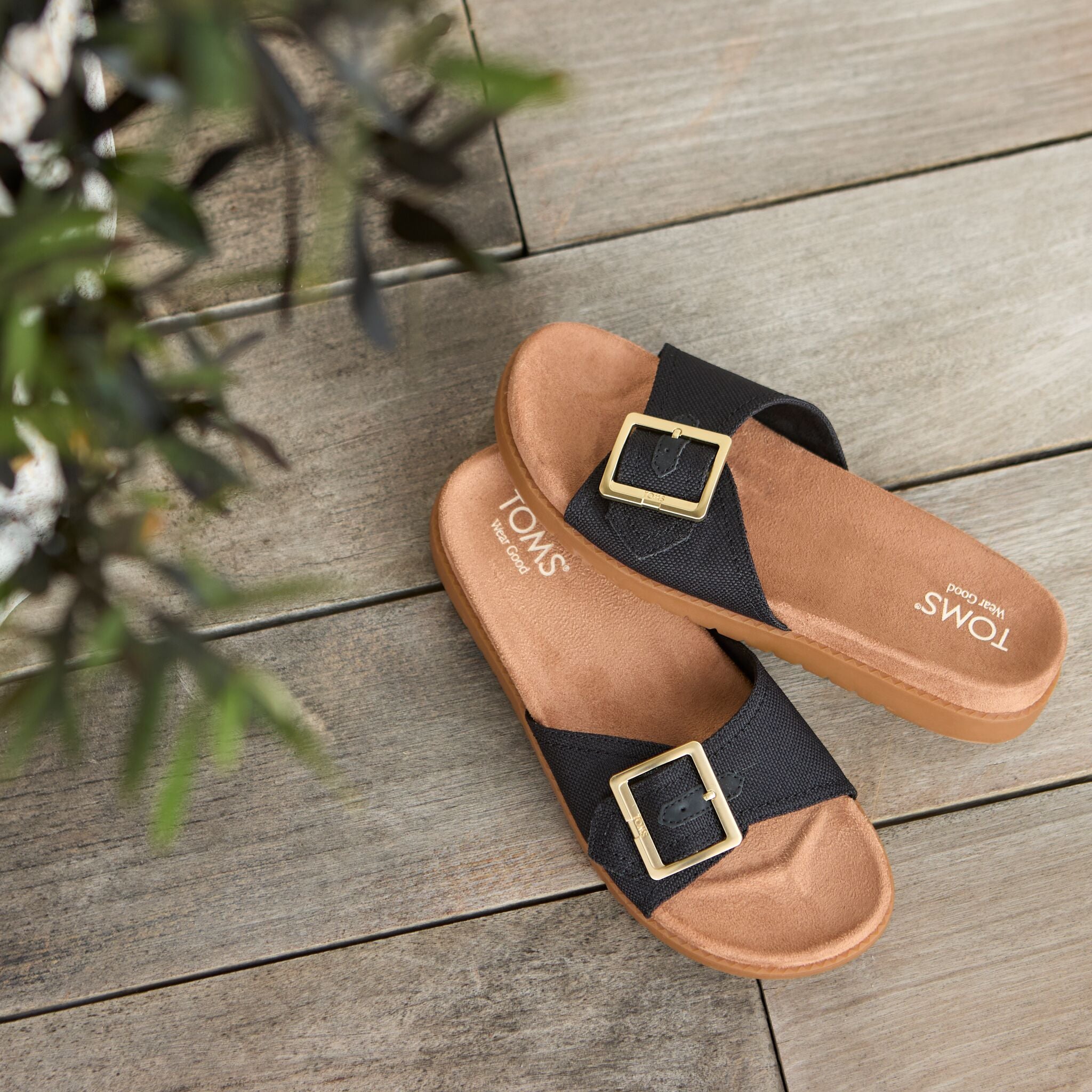 Laydown image of the black Marin slide sandal