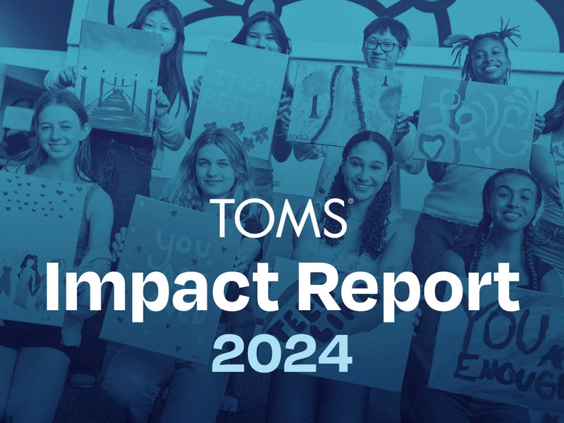 Group of people holding signs with TOMS logo and 'Impact Report 2024' text overlay.