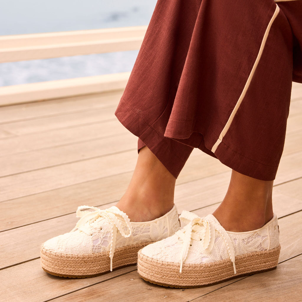 On model image of the white floral crochet Valencia lace up espadrille