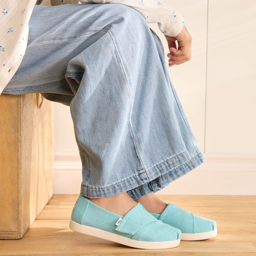 On model image of the Kids Cerulean Blue Alpargata