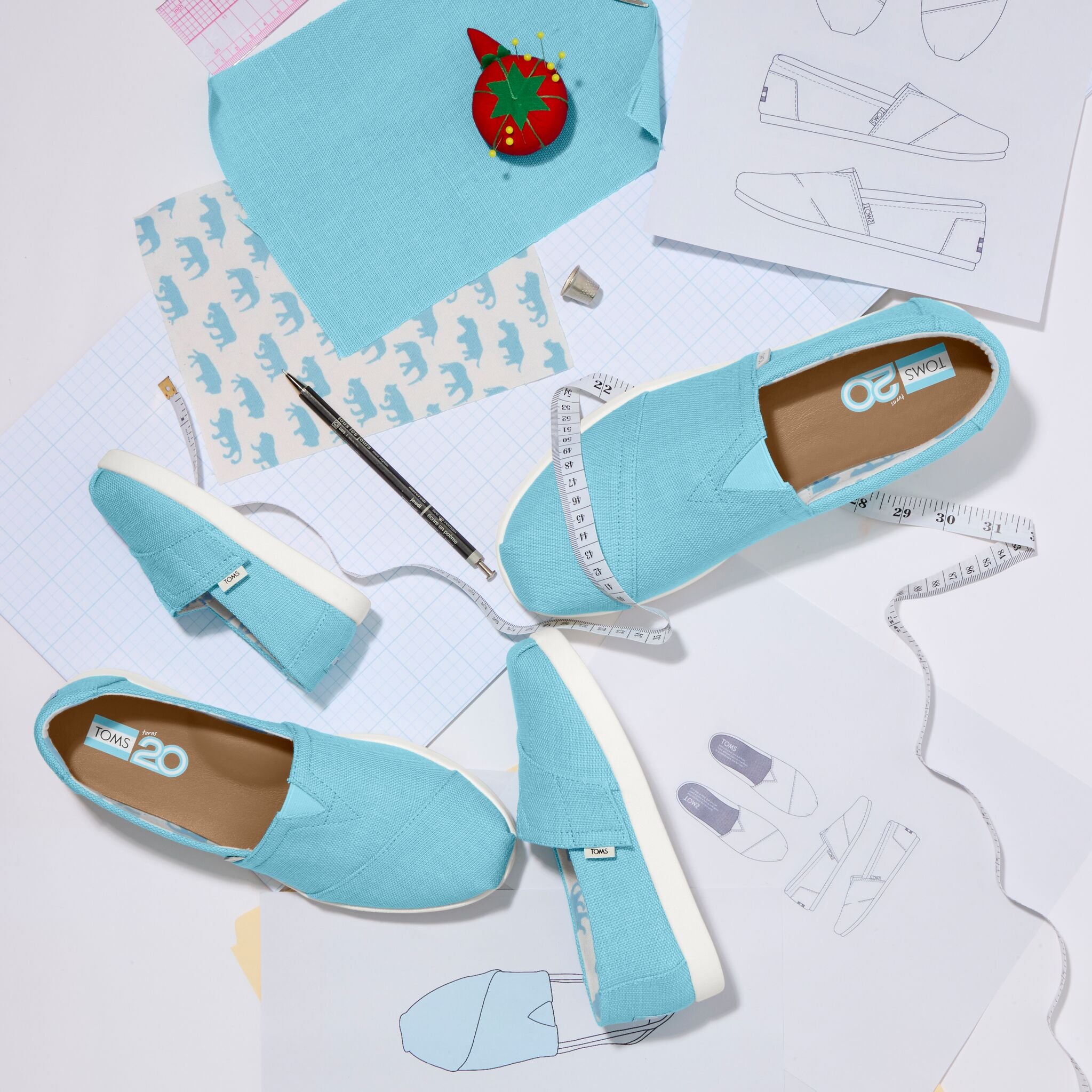 Laydown image featuring the 20th Anniversary Cerulean blue Mens, Womens, Kids Alpargatas